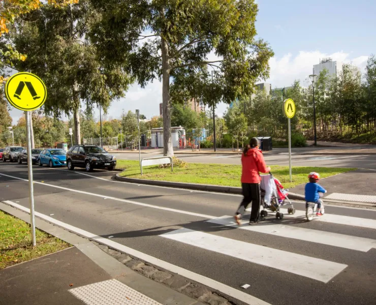 Family walking across a crosswalk