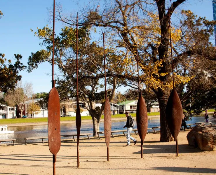 The Birrarung Wilam sculpture alongside the Yarra River/Birrarung Marr in Melbourne. It depicts five bronze shields with Aboriginal carvings.