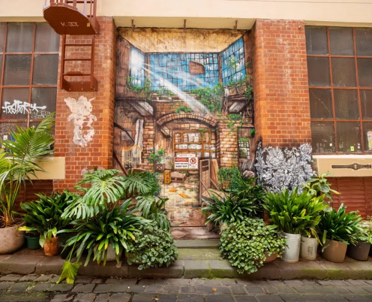 Green plants in Guildford Lane in front of mural showing green infrastructure