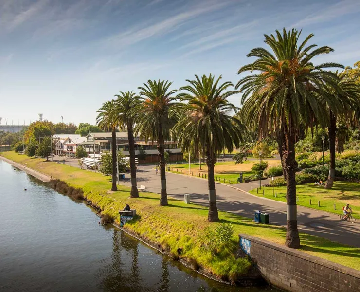 A view of Alexandra Gardens from Princes Bridge showing the line of boathouses facing the river.