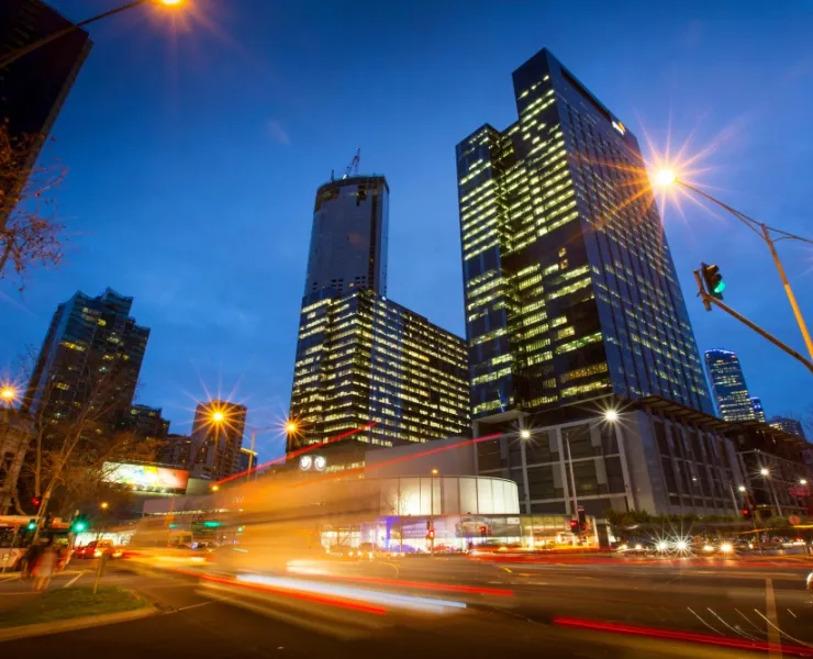 Blurred lights of city traffic at night with skyscrapers