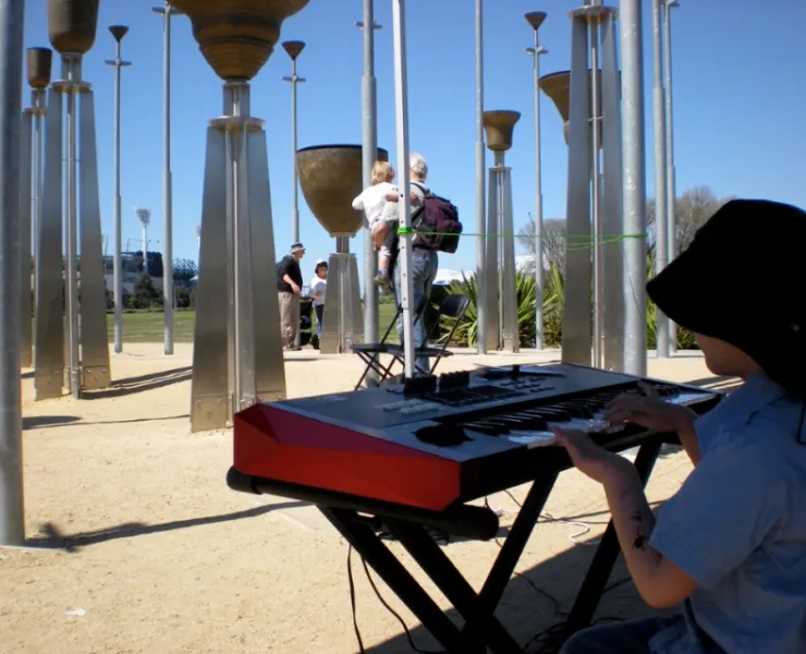 Child playing keyboard at Federation Bells