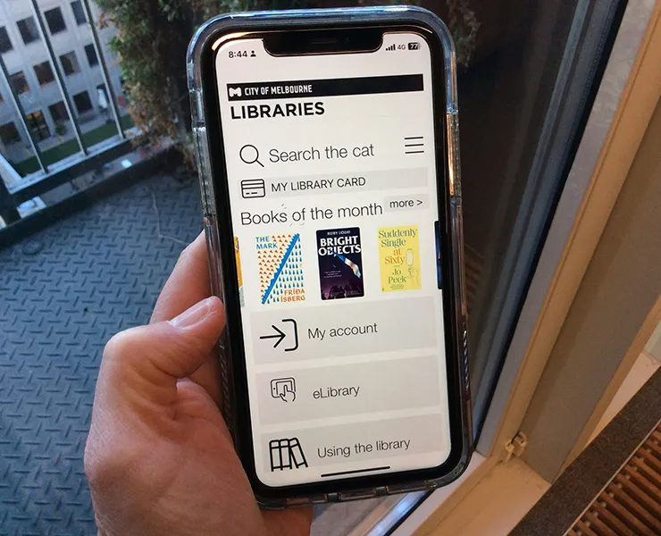 Person accessing libraries app on phone screen