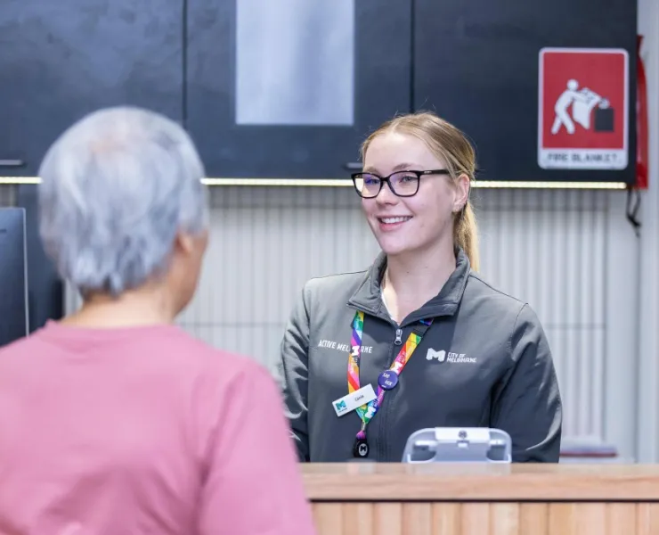 Melbourne City Baths front desk staff answering inquiry