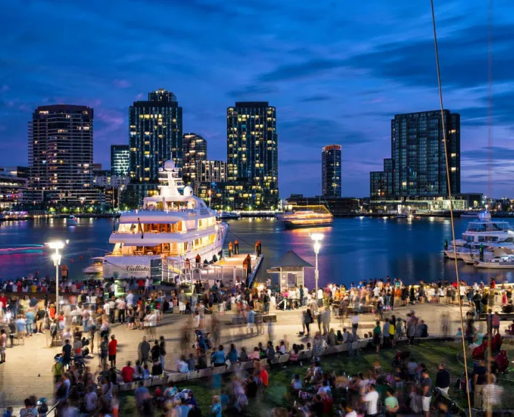 New Year's Eve crowd gathered around large vessel berthing