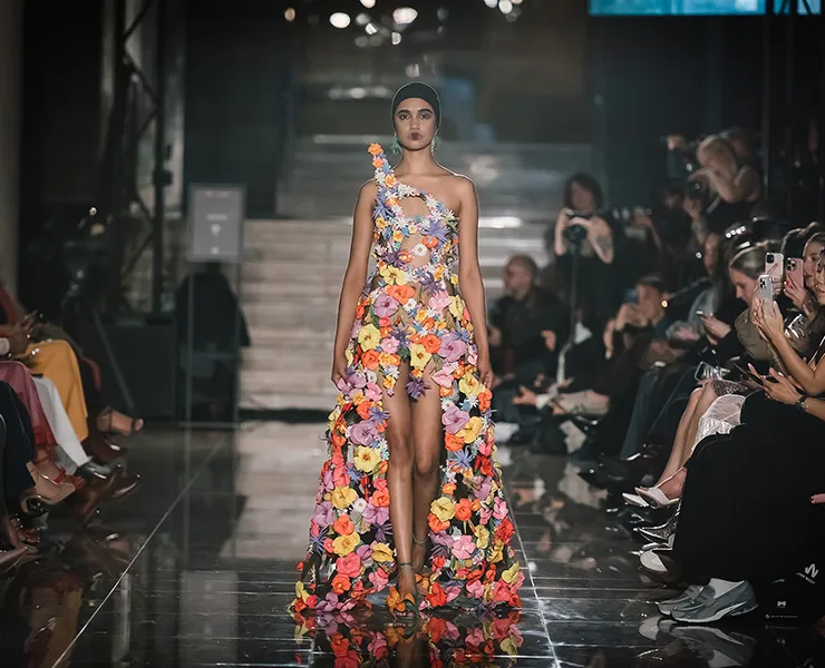 A model walking down the runway at Melbourne Fashion Week.