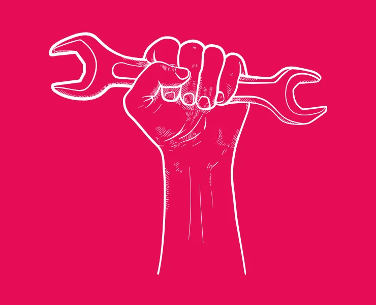 hand holding a spanner