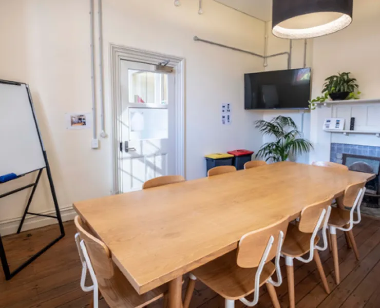 The Principal's office set up with a small wooden table and six chairs