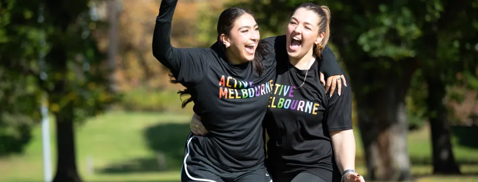 Two sportswomen celebrating an act of sporting excellence