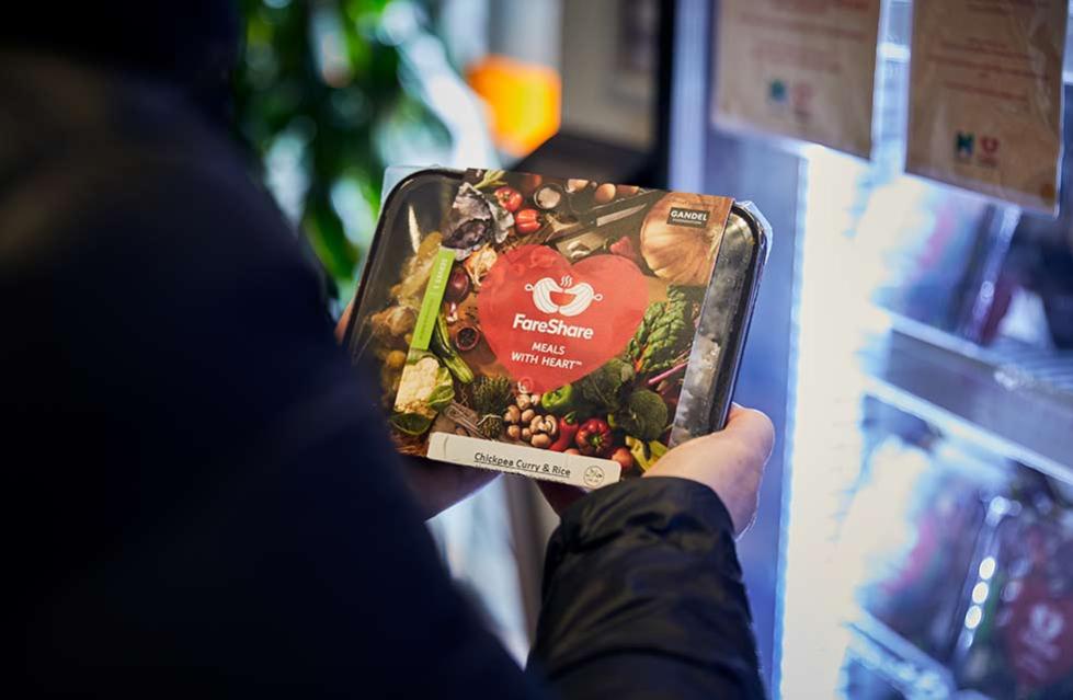 person holds a freezer meal