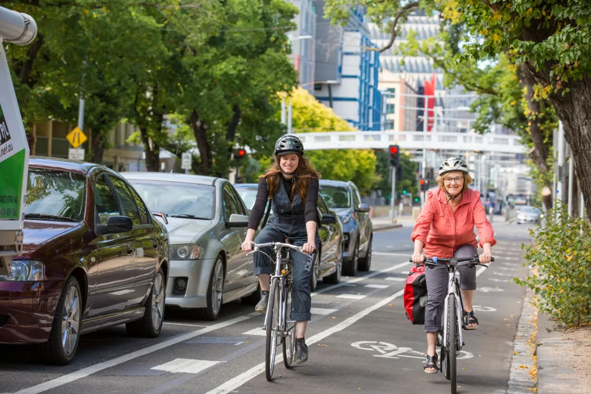 Cyclists riding bikes on Swanston Elgin Street.