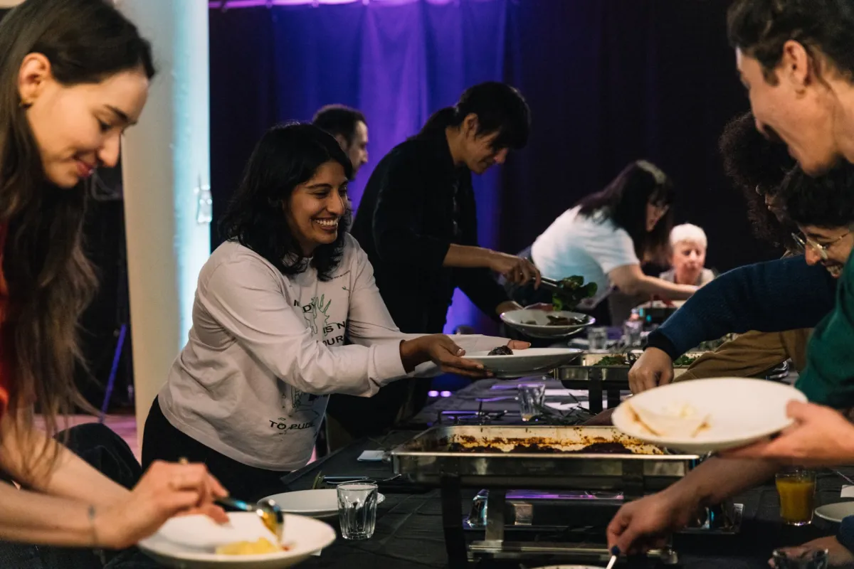 People sharing a communal meal