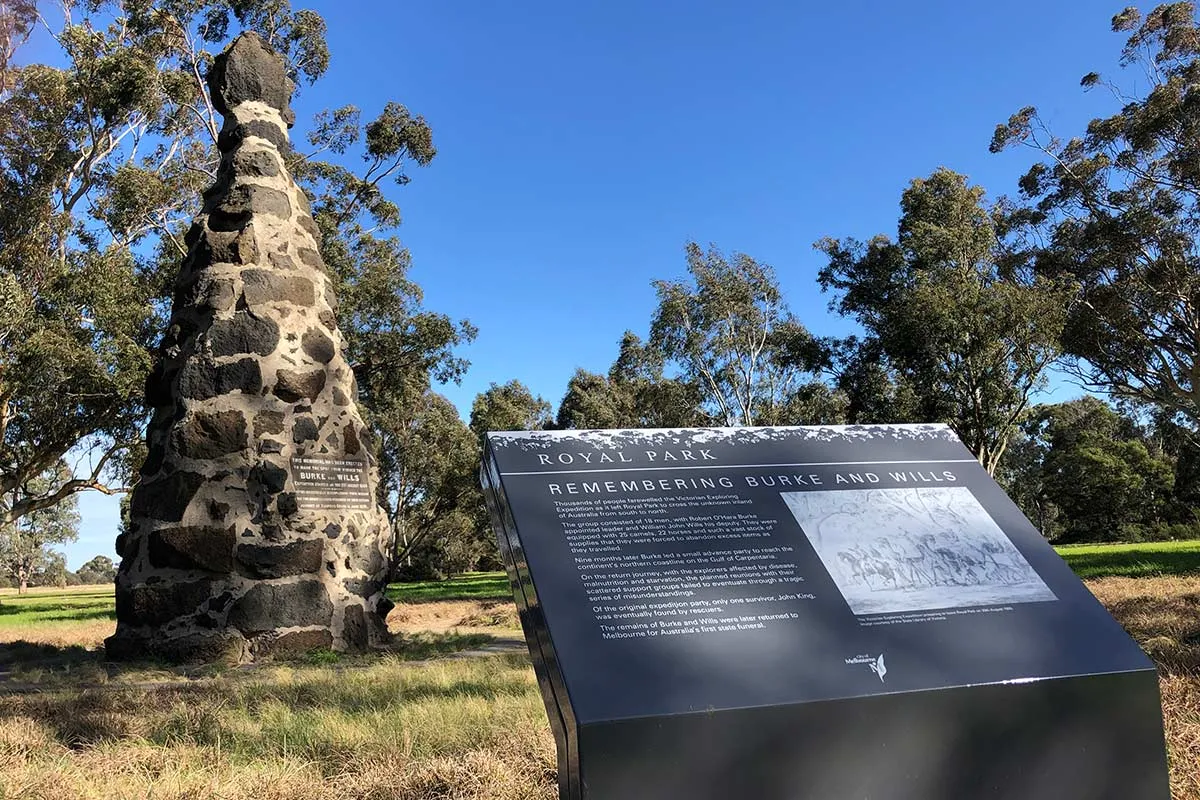 A stone cairn with an information board